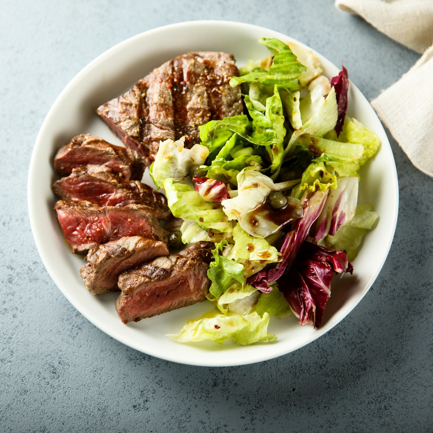 Grilled steak salad with mixed greens